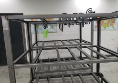 a large welded frame with three racks
